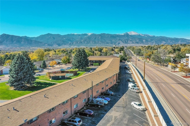 birds eye view of property with a mountain view