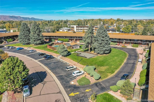 birds eye view of property with a mountain view