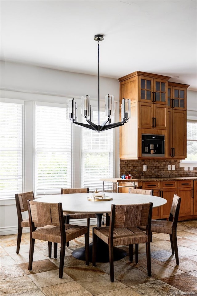 dining space featuring an inviting chandelier