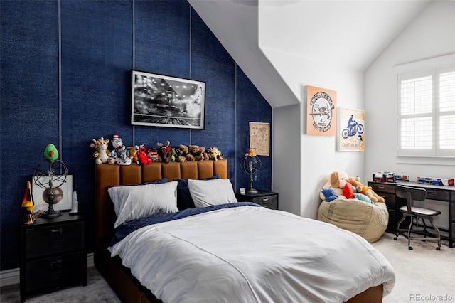 bedroom with carpet flooring and lofted ceiling