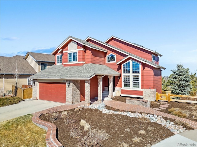 view of front facade featuring driveway, a garage, fence, and roof with shingles