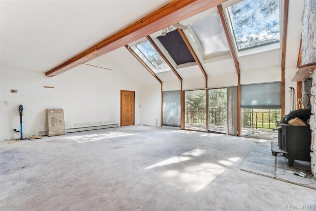 3909 County Road 72, Bailey, CO 80421 - unfurnished living room featuring high vaulted ceiling, a wood stove, a baseboard radiator, a skylight, and beam ceiling
