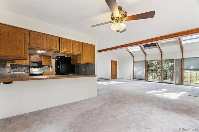 3909 County Road 72, Bailey, CO 80421 - kitchen featuring black appliances, light carpet, brown cabinets, and backsplash