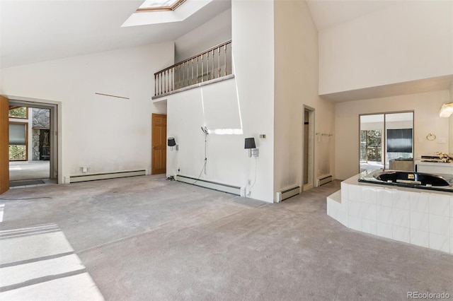 3909 County Road 72, Bailey, CO 80421 - unfurnished living room featuring high vaulted ceiling, a baseboard radiator, carpet flooring, and baseboard heating