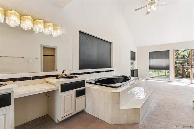 3909 County Road 72, Bailey, CO 80421 - kitchen with carpet floors, tile countertops, high vaulted ceiling, open floor plan, and a ceiling fan