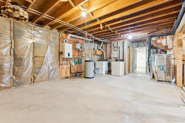 3909 County Road 72, Bailey, CO 80421 - unfinished below grade area featuring tankless water heater, independent washer and dryer, a water softener system, and heating unit