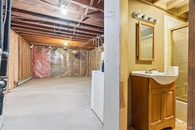 3909 County Road 72, Bailey, CO 80421 - unfinished basement with a baseboard heating unit and washer / dryer