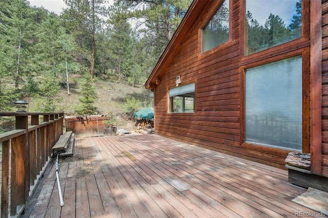 3909 County Road 72, Bailey, CO 80421 - wooden terrace with a view of trees