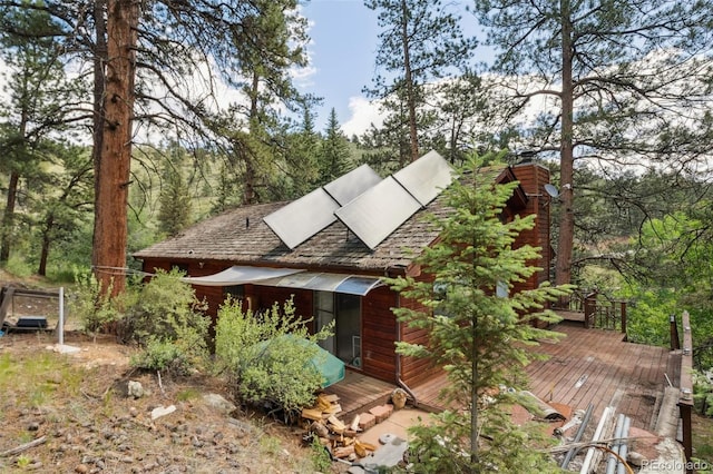 3909 County Road 72, Bailey, CO 80421 - view of front of home featuring a wooden deck and a chimney