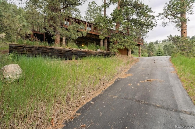 3909 County Road 72, Bailey, CO 80421 - view of front facade featuring asphalt driveway and a deck