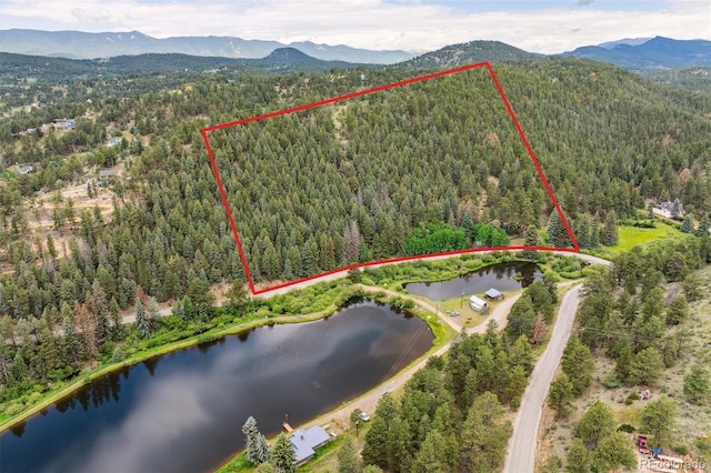 3909 County Road 72, Bailey, CO 80421 - aerial view of property's location with property boundaries highlighted and a water and mountain view