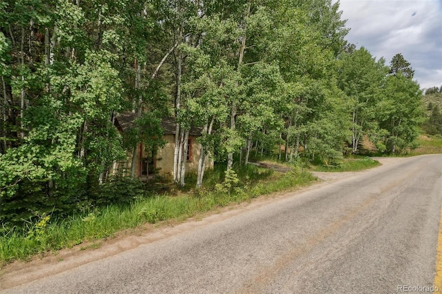 3909 County Road 72, Bailey, CO 80421 - view of asphalt street with a view of trees