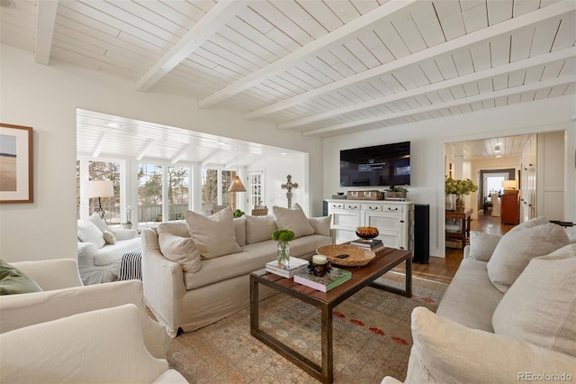 living room with wood ceiling, hardwood / wood-style floors, and beamed ceiling