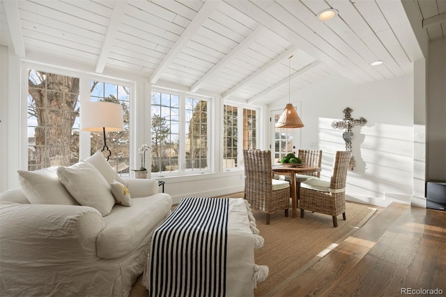 sunroom featuring lofted ceiling with beams and wood ceiling