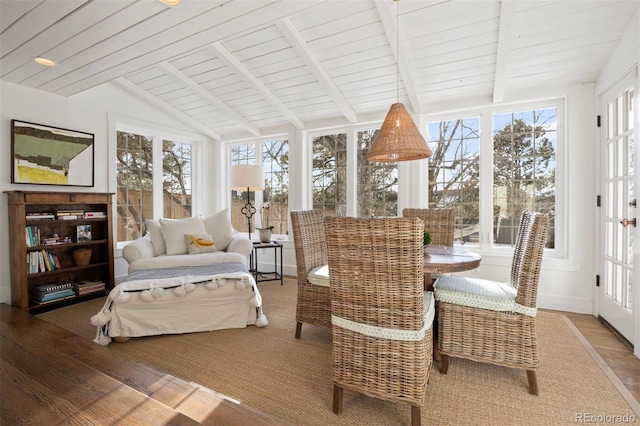 sunroom featuring wooden ceiling and lofted ceiling with beams