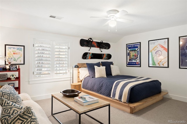 bedroom with ceiling fan, carpet, and vaulted ceiling