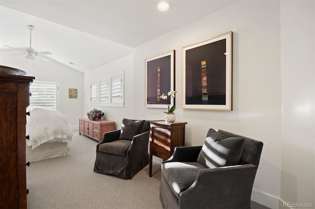 carpeted bedroom with ceiling fan and vaulted ceiling