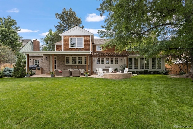 back of house featuring a patio area, a lawn, and outdoor lounge area