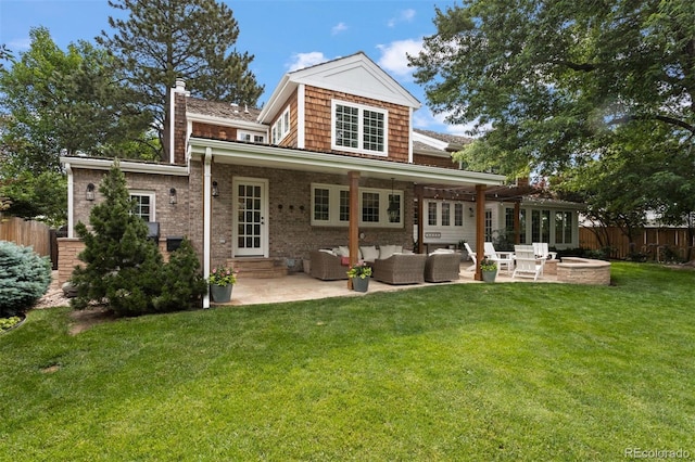 rear view of property with a patio area, a lawn, and outdoor lounge area