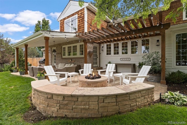 view of patio featuring an outdoor living space with a fire pit