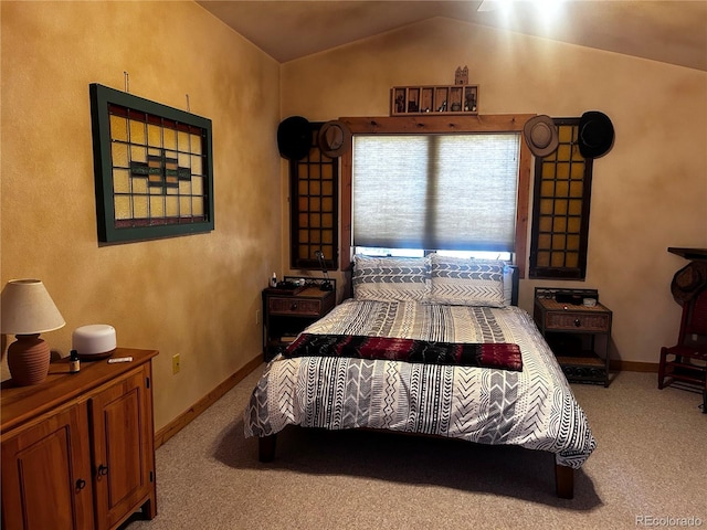 bedroom featuring carpet flooring and vaulted ceiling