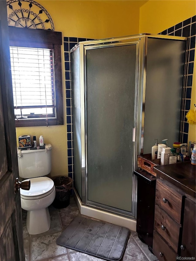 full bathroom with vanity and a shower stall