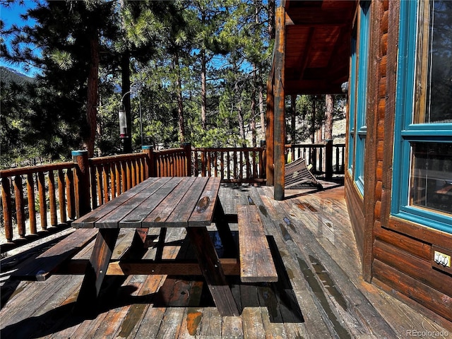 wooden deck with outdoor dining space