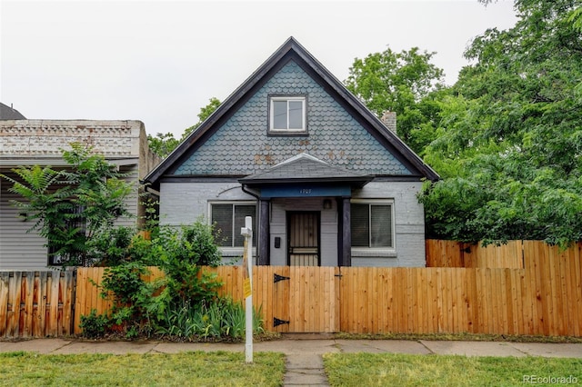 1707 W 39th Ave, Denver, CO 80211 - victorian house featuring a fenced front yard and a gate