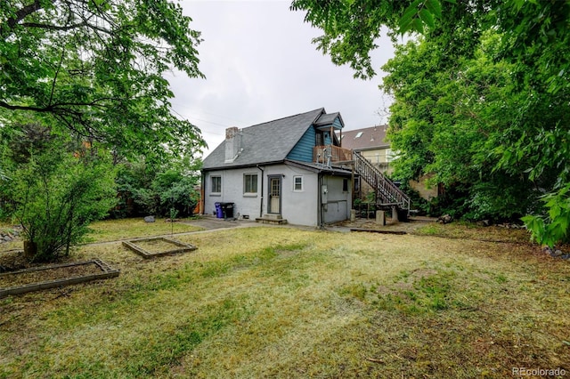 1707 W 39th Ave, Denver, CO 80211 - back of house featuring stairway and a yard