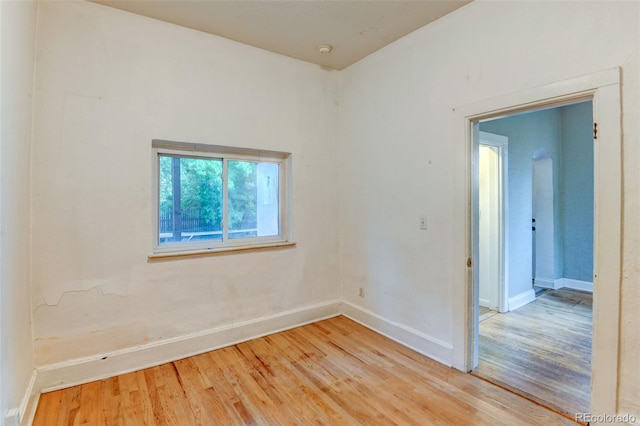 1707 W 39th Ave, Denver, CO 80211 - spare room featuring light wood-type flooring and a smoke detector