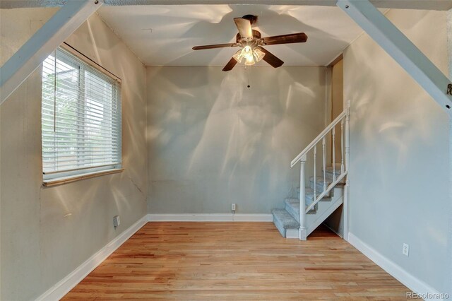 1707 W 39th Ave, Denver, CO 80211 - unfurnished living room with wood finished floors, ceiling fan, and stairs