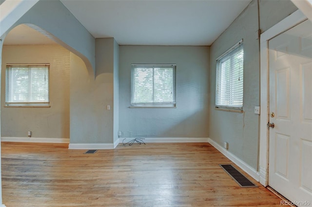 1707 W 39th Ave, Denver, CO 80211 - entrance foyer featuring arched walkways and light wood finished floors