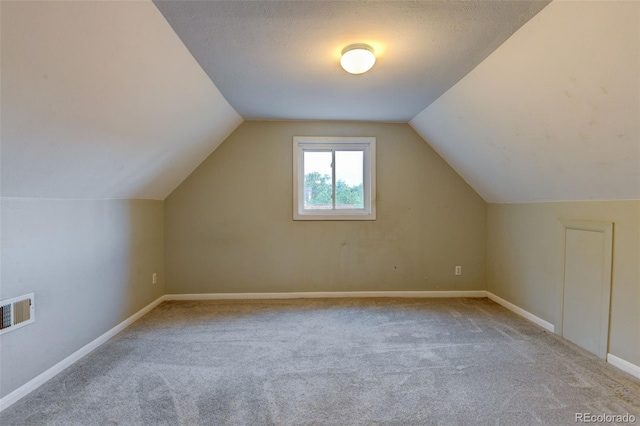 1707 W 39th Ave, Denver, CO 80211 - additional living space with carpet flooring and lofted ceiling