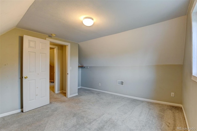 1707 W 39th Ave, Denver, CO 80211 - unfurnished bedroom with vaulted ceiling and carpet flooring