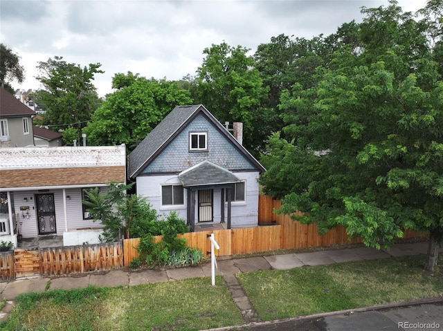 1707 W 39th Ave, Denver, CO 80211 - view of front of property with a fenced front yard, covered porch, and a chimney