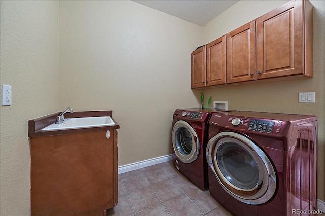 15258 W 75th Pl, Arvada, CO 80007 - washroom with washing machine and dryer, cabinet space, baseboards, and light tile patterned flooring