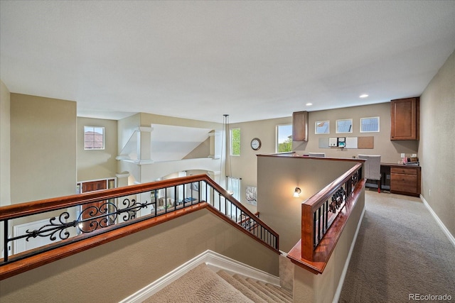 15258 W 75th Pl, Arvada, CO 80007 - stairway with carpet flooring, baseboards, plenty of natural light, built in desk, and recessed lighting