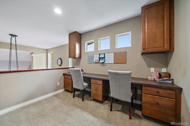 15258 W 75th Pl, Arvada, CO 80007 - office with healthy amount of natural light, built in study area, light carpet, and baseboards