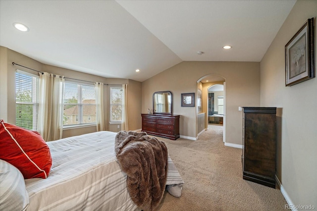 15258 W 75th Pl, Arvada, CO 80007 - bedroom featuring vaulted ceiling, light colored carpet, arched walkways, baseboards, and recessed lighting