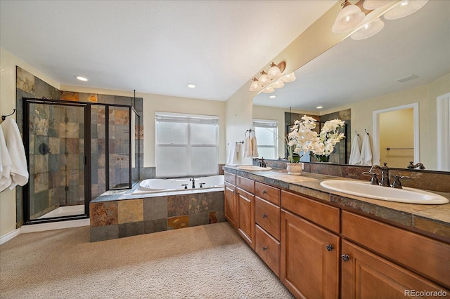 15258 W 75th Pl, Arvada, CO 80007 - full bath with double vanity, a garden tub, a shower stall, and recessed lighting