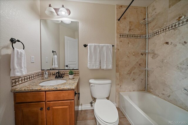 15258 W 75th Pl, Arvada, CO 80007 - full bathroom featuring vanity, toilet, shower / washtub combination, and tile patterned floors