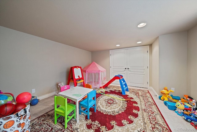 15258 W 75th Pl, Arvada, CO 80007 - recreation room featuring carpet flooring, baseboards, and recessed lighting