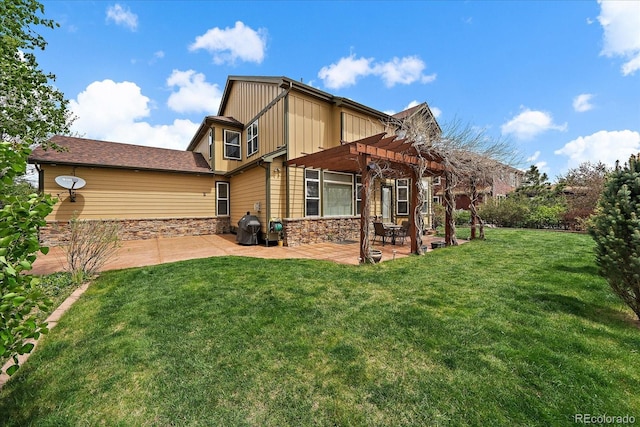 15258 W 75th Pl, Arvada, CO 80007 - rear view of house featuring a pergola, a patio, stone siding, a lawn, and board and batten siding