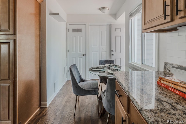 2260 Lilly Dr, Thornton, CO 80229 - office area with wood finished floors and healthy amount of natural light