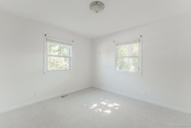 2260 Lilly Dr, Thornton, CO 80229 - spare room with plenty of natural light and carpet flooring