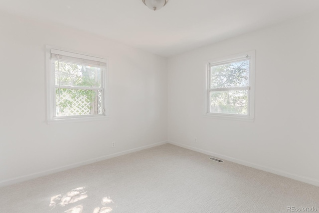2260 Lilly Dr, Thornton, CO 80229 - spare room with plenty of natural light and carpet floors