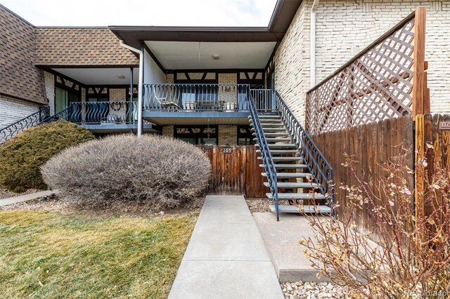 exterior space with stairs and fence