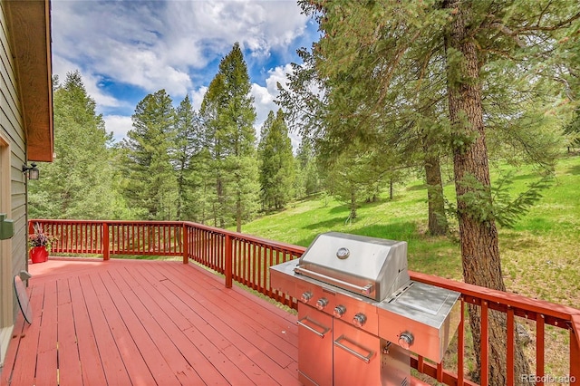 28065 Camel Heights Cir, Evergreen, CO 80439 - wooden deck featuring a lawn