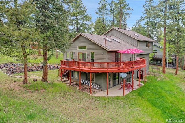 28065 Camel Heights Cir, Evergreen, CO 80439 - back of house with a deck, a patio, a yard, and a shingled roof