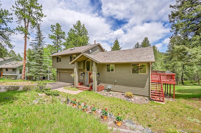 28065 Camel Heights Cir, Evergreen, CO 80439 - view of front of property with a garage, stairway, a wooden deck, driveway, and a front lawn